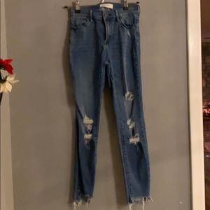 Medium wash jeggings distressed